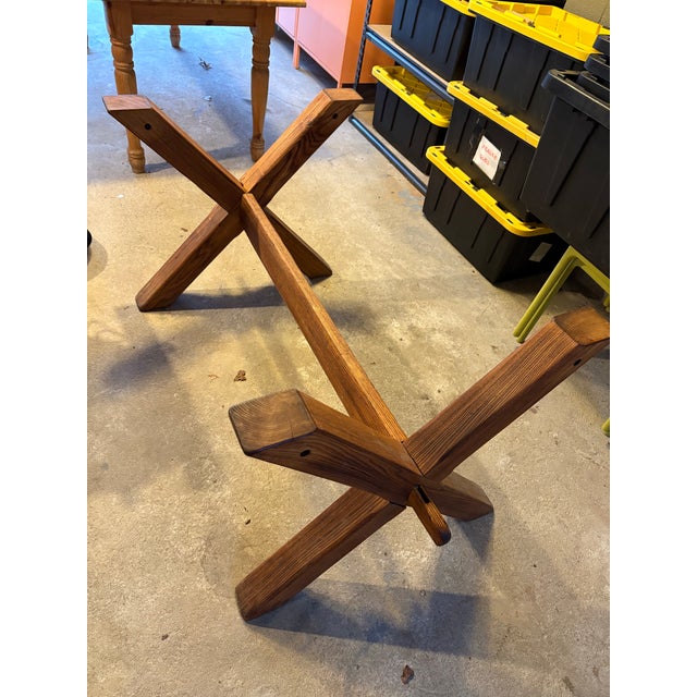 Recently refinished Heavy, solid pine top. Trestle base comes apart and does back together easily. Unknown origin.