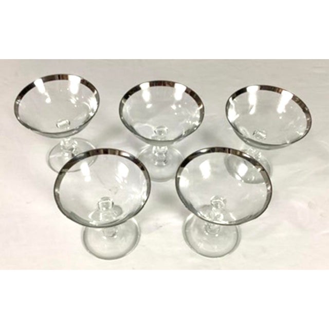 Fostoria glass company-(late 19th century to the 1980s)-“ wedding ring” crystal champagne, glasses with platinum rims and...