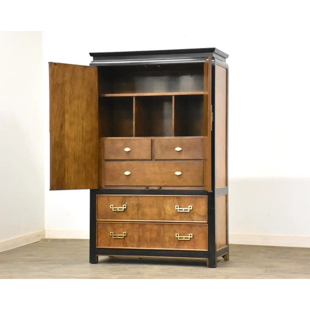 A Japanese style burl and black ebonized dresser armoire designed by Raymond Sobota for Century Furniture’s Chin Hua...