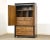 A Japanese style burl and black ebonized dresser armoire designed by Raymond Sobota for Century Furniture’s Chin Hua...