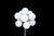 The lamp features eleven white glass globes arranged in a compact radial cluster at the top of a slender chrome-plated...