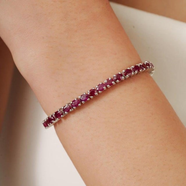 Add timeless elegance to your jewelry collection with this beautiful 925 sterling silver ruby tennis bracelet. Designed...