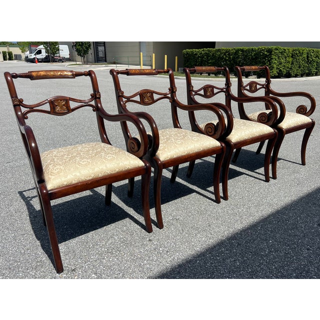 English Regency set of four wood dining room chairs with scrolled bulbous crest rails, scrolled arms, brass foliage...