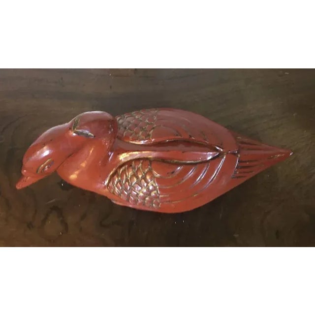 Antique Chinese red/orange lacquer carved wood duck box with gilt highlights. Dates from the early 20th century. Measures...