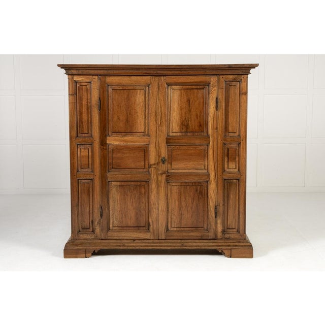 18th century italian walnut cabinet an 18th century italian walnut cabinet. this cabinet is panelled throughout with two...