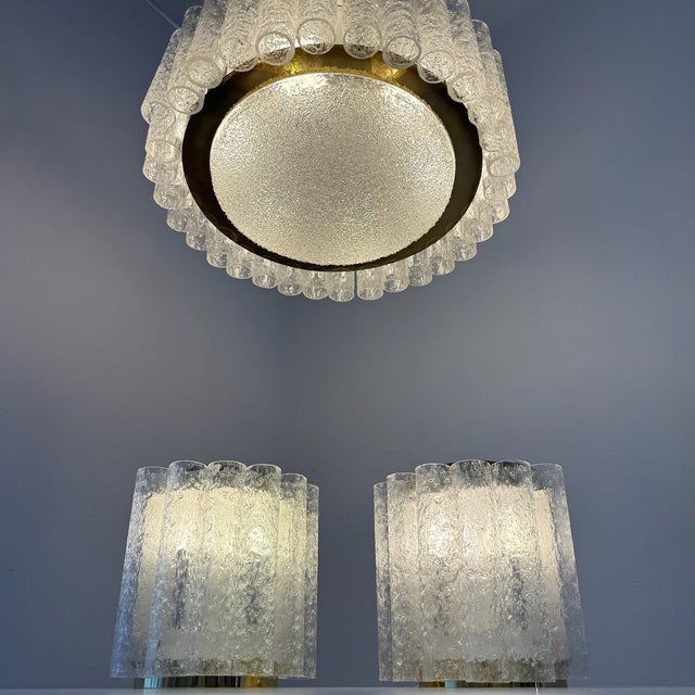 Museum-quality and extremely rare three-piece lighting set from the renowned Doria workshops, crafted during the heyday of...