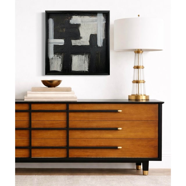 Bold contrasts and fractured forms define Cataclysm by J. Kent Martin, where black, white, and gray collide in a dynamic...