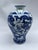 A single small Chinese export porcelain baluster form vase featuring traditional hand painted dragon decoration.