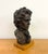 A vintage figural bust depicting a distinguished gentleman in formal attire, rendered with deeply textured, expressive...