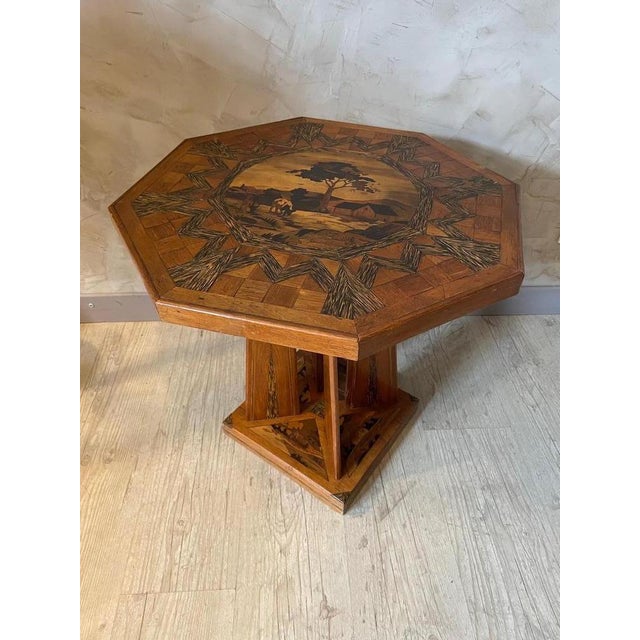 Beautiful and rare auxiliary or pedestal table produced in the 1920s in oak marquetry. There is marquetry on the top and...
