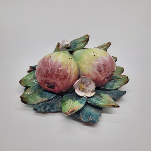 Handcrafted Italian ceramic wall plaque by Ceramiche Perconte features a lush dimensional arrangement of figs, green...