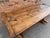 This is a beautiful 19th century English dining table! The Pine wood has a light natural tone, with lovely natural worn...