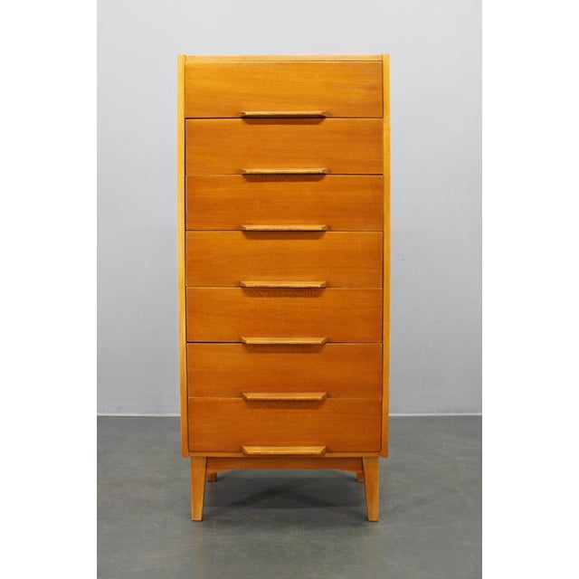 This elegant mid-century modern chest of drawers was produced in Czechoslovakia during the 1960s and exemplifies the...