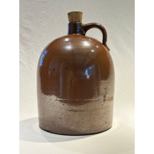 N.H. Lavender Pottery Jug 13.25” H x 8.5” Diameter Rust Glaze Pottery Jug 12.5” H x 9.25” Diameter Benton Pottery Jug...