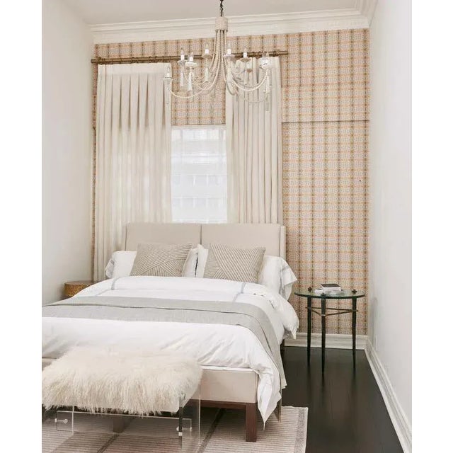 The handcrafted bronze Domani side table has tapered legs held by a triangular hand-sculpted bronze stretcher. Bronze...