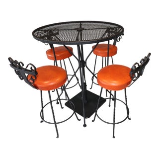 Vintage Spanish Revival Wrought Iron Swivel Bar Stool Set With Matching Mesh Bar Table & Heavy Umbrella Stand – Mid-Century, Orange Vinyl For Sale