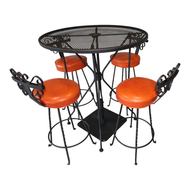 Vintage Spanish Revival Wrought Iron Swivel Bar Stool Set With Matching Mesh Bar Table & Heavy Umbrella Stand – Mid-Century, Orange Vinyl For Sale