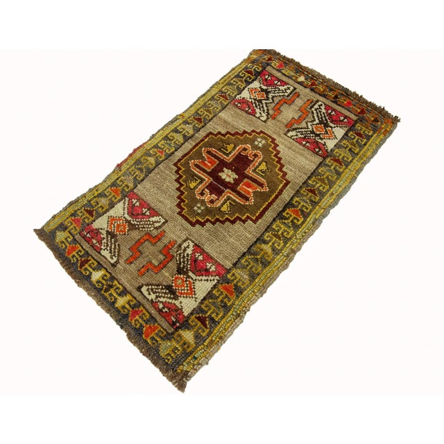 Vintage Handknotted decorative mini rug from Kars region of Turkey. Approximately 45-55 years old. In very good condition.