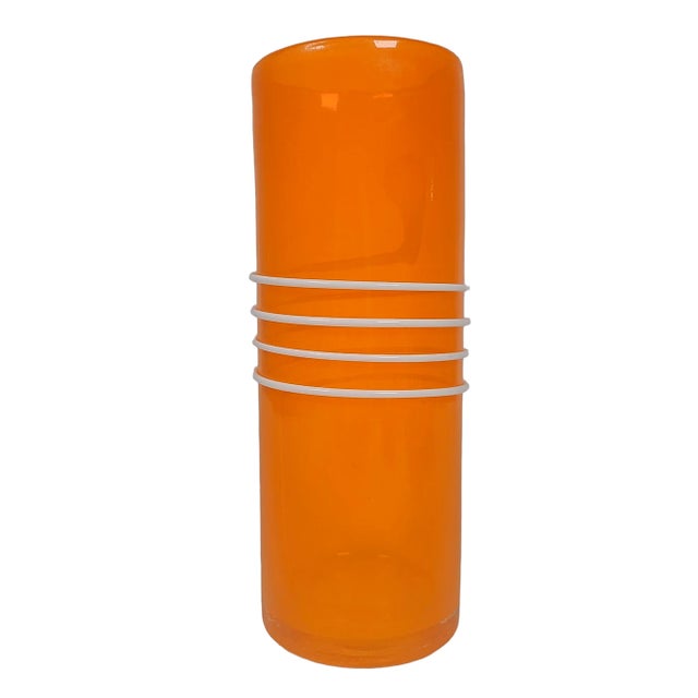 Eye catching 1970's hand blown Italian modernist abstract glass vase. Vibrant orange cased glass encircled with a...