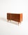 Teak highboard with two side compartments, six central drawers, and oak details. Shaped handles and tapered legs....