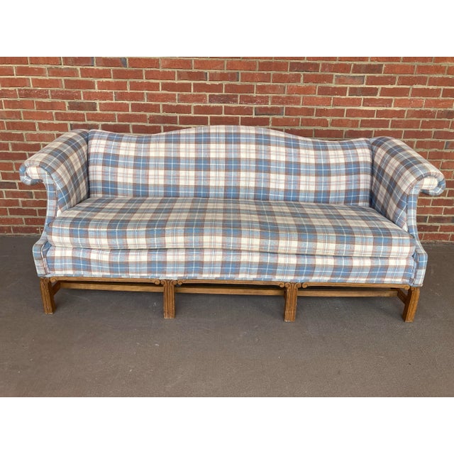 A rare and well preserved mid-20th century camel back sofa in original cottage core style plaid fabric with chinoiserie...