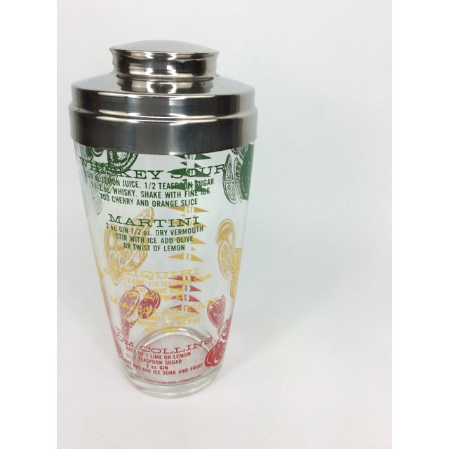Vintage Mr Bartender Recipe Cocktail Shaker with recipes and fruits in red, yellow and green.