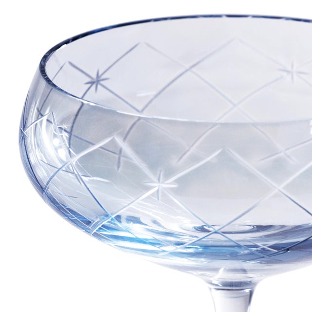 A stunning addition to any bar collection, this set of four coupe glasses features lustrous, hand-painted color cups with...