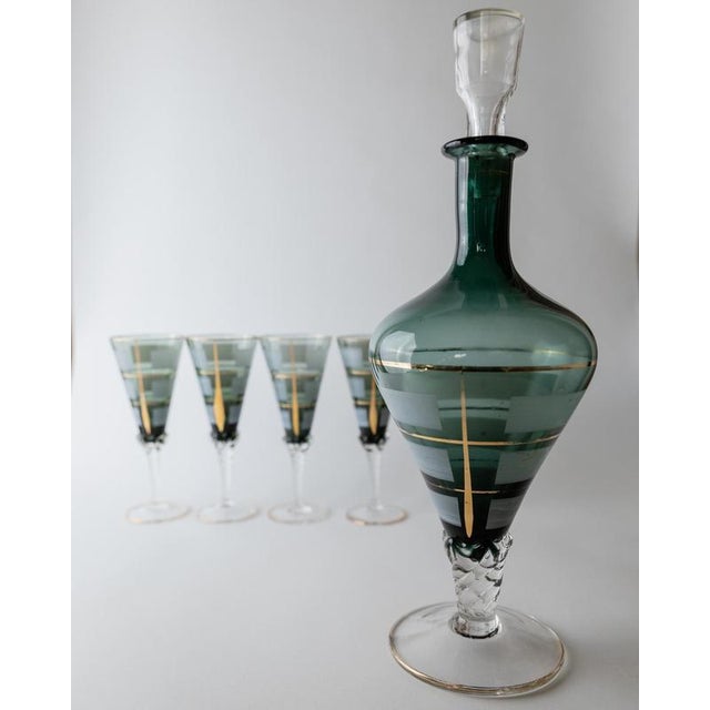 This vintage Murano glass liqueur set from the 1950s is an elegant example of Italian glass craftsmanship. Featuring a...