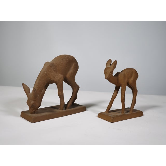 Two-piece terracotta deer figurine set, designed by Else Bach for Karlsruhe Majolica. A serene, naturalistic design with a...