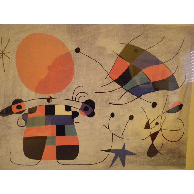 Lithograph by Miró, Spanish artist. This lithograph is from the series "Surrealist Figure and the Sun," featuring organic...