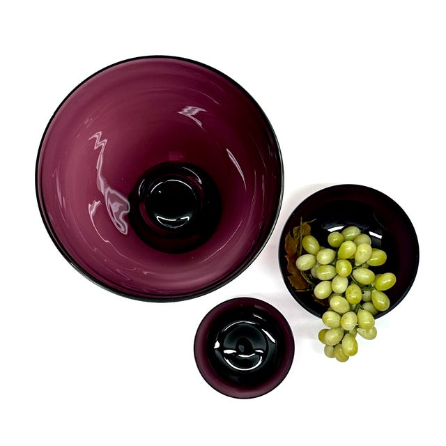 Amethyst glass bowls, group of 3. A gorgeous set of amethyst purple bowls from the mid-20th century. Condition: The...