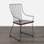 This Crate & Barrel chair features a sturdy black metal frame with a slatted dark wood seat. Its modern, open-back design...