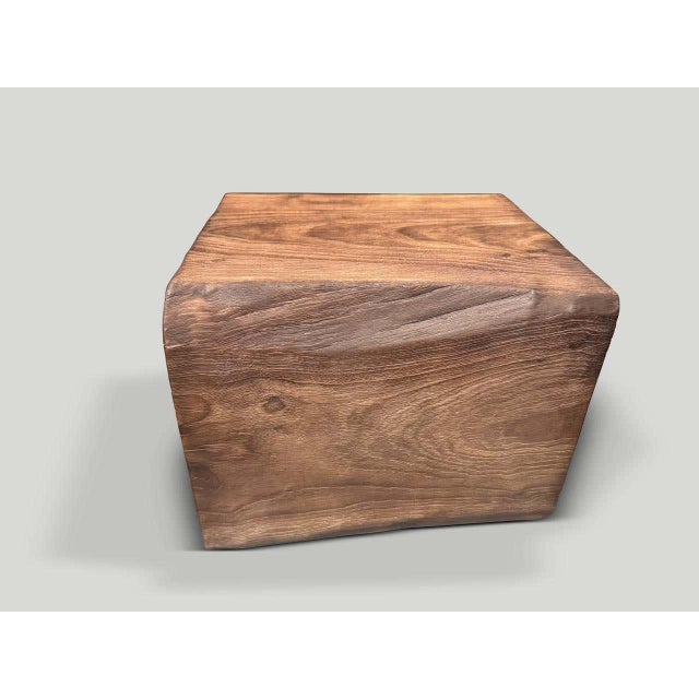 "A century old teak root hand carved into a usable shape to produce a sculptural side table, whilst respecting the natural...