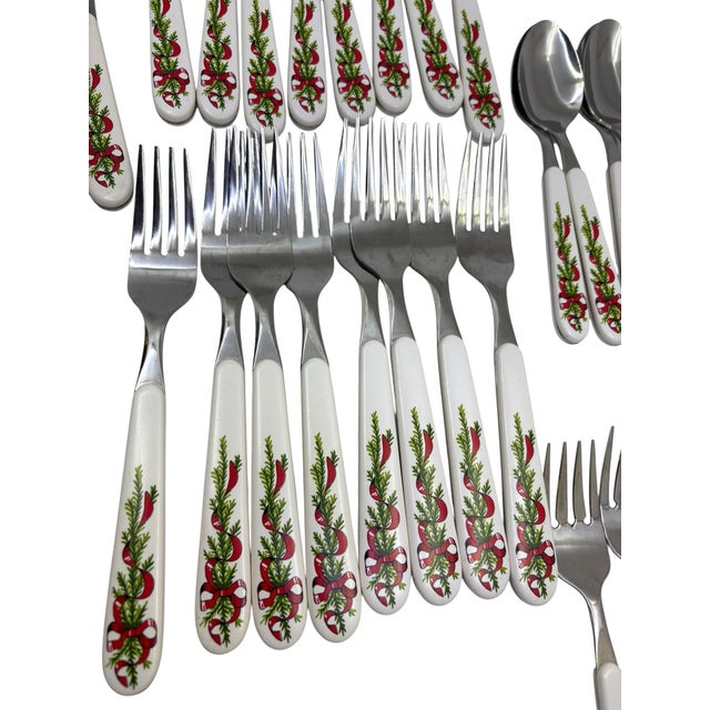 Oneida Stainless steel Christmas bow with evergreen design silverware for a seating of 8 people. Vintage Oneida Christmas...