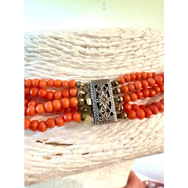 Stunning vintage Coral multi-strand necklace with sterling silver clasp. Length: 17”