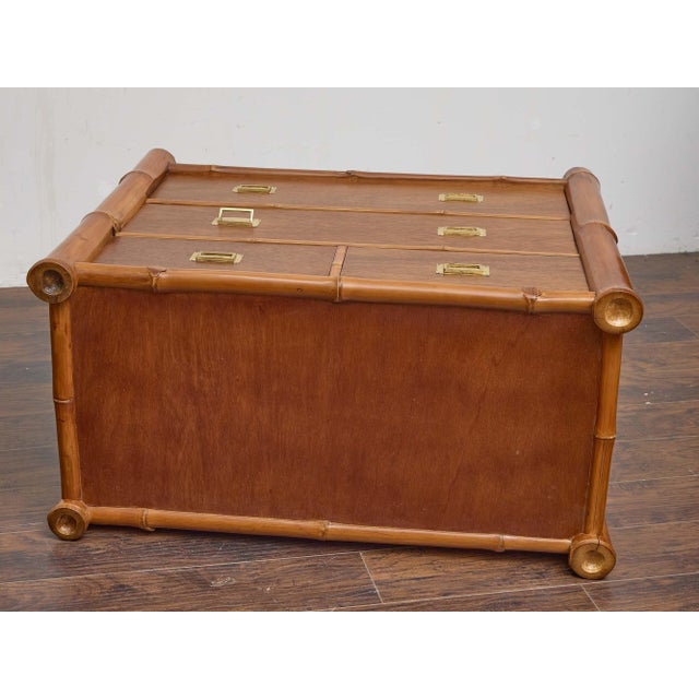 A midcentury chest of drawers, crafted with a solid mahogany body framed by bold bamboo poles at the corners and edges....