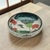 Japanese Kyo-Yaki style bowl decorated with lotus leaves, lotus blossoms, and a hovering bird motif beneath a crackle...