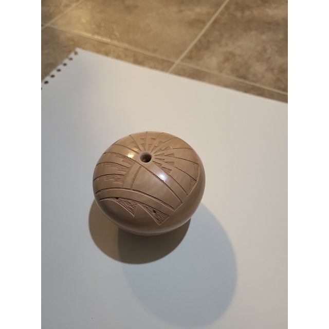 This unique Hopi-Tewa seed jar is a rare find for collectors of Native American pottery. The jar was handcrafted and...