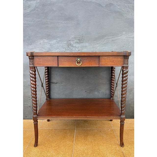 Charming English side table in the Jacobean Revival style, dating from the early 20th century. The table features a...