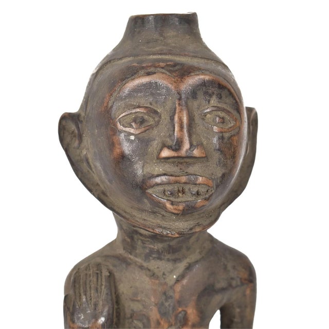 The Yaka Male Miniature Figure from Congo is a captivating example of the intricate artistry and cultural significance of...