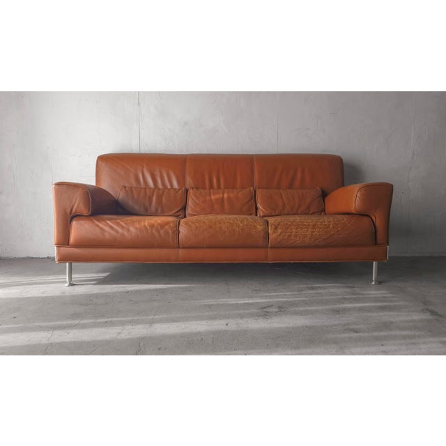 Lovely 90s vintage Leather sofa. Interesting shape and style. Leather is a nice terracotta color. Sofa is heavy and solid....