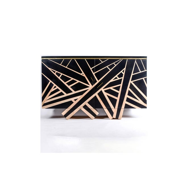 The "Lines" sideboard, designed by Aymeric Lefort, is crafted from stained pearwood marquetry and holly wood, with a...