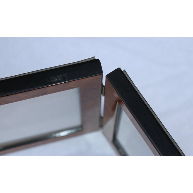 Beautifully crafted double frame made of burlwood and brass hardware. Bears original stickers. I love the grain of the...