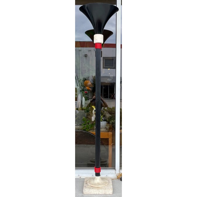 Cool and trendy Italian Postmodern floor lamp. Made of metal in black finish with red accents. Shade interior is white...