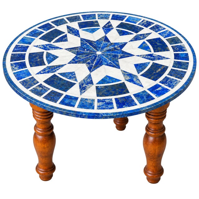 Beautiful round stone-inlay table featuring a striking geometric starburst mosaic top made with genuine lapis lazuli and...