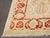 Safavieh Oushak Wool Carpet, with red and beige floral motif, label to underside. 14' 2" L x 9' 10.5" W. Provenance: From...