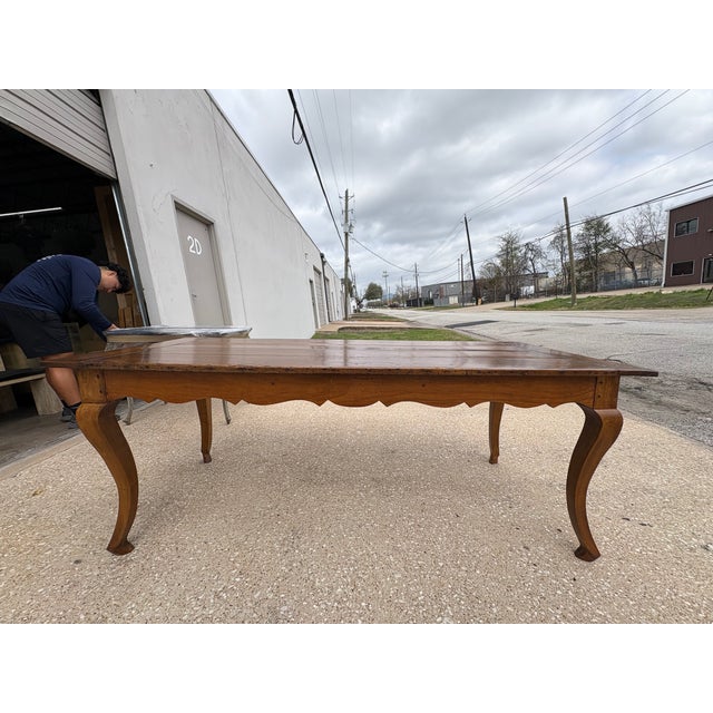 19th Century French Louis XV Style Walnut Table. Offered is a versatile mid 19th century French Louis XV style walnut farm...
