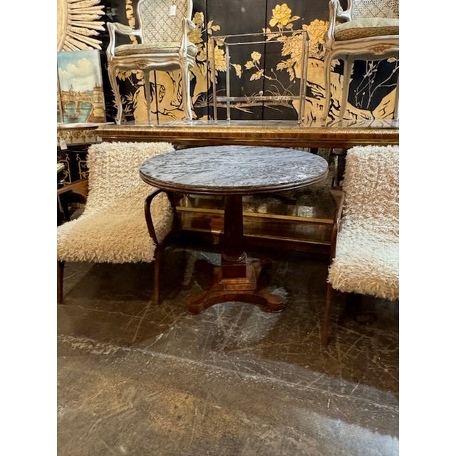 19th century Italian carved walnut center table with grey marble top. Circa 1860. A fine addition to any home! 39w x 31.5h