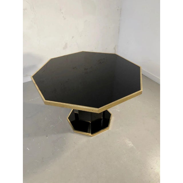 An impressive and very chic octagonal dinner, post-modernist, shabby-chic, octagonal black lacquered wooden base...