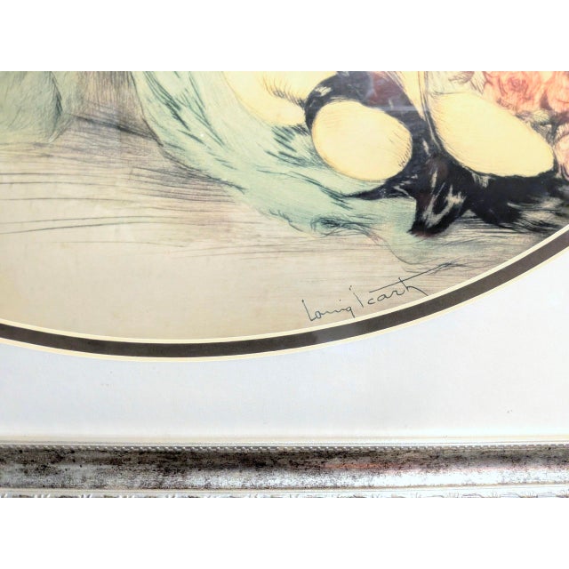 Bring classic 1920s Parisian glamour into your home with this stunning vintage mid-century reproduction of Louis Icart’s...